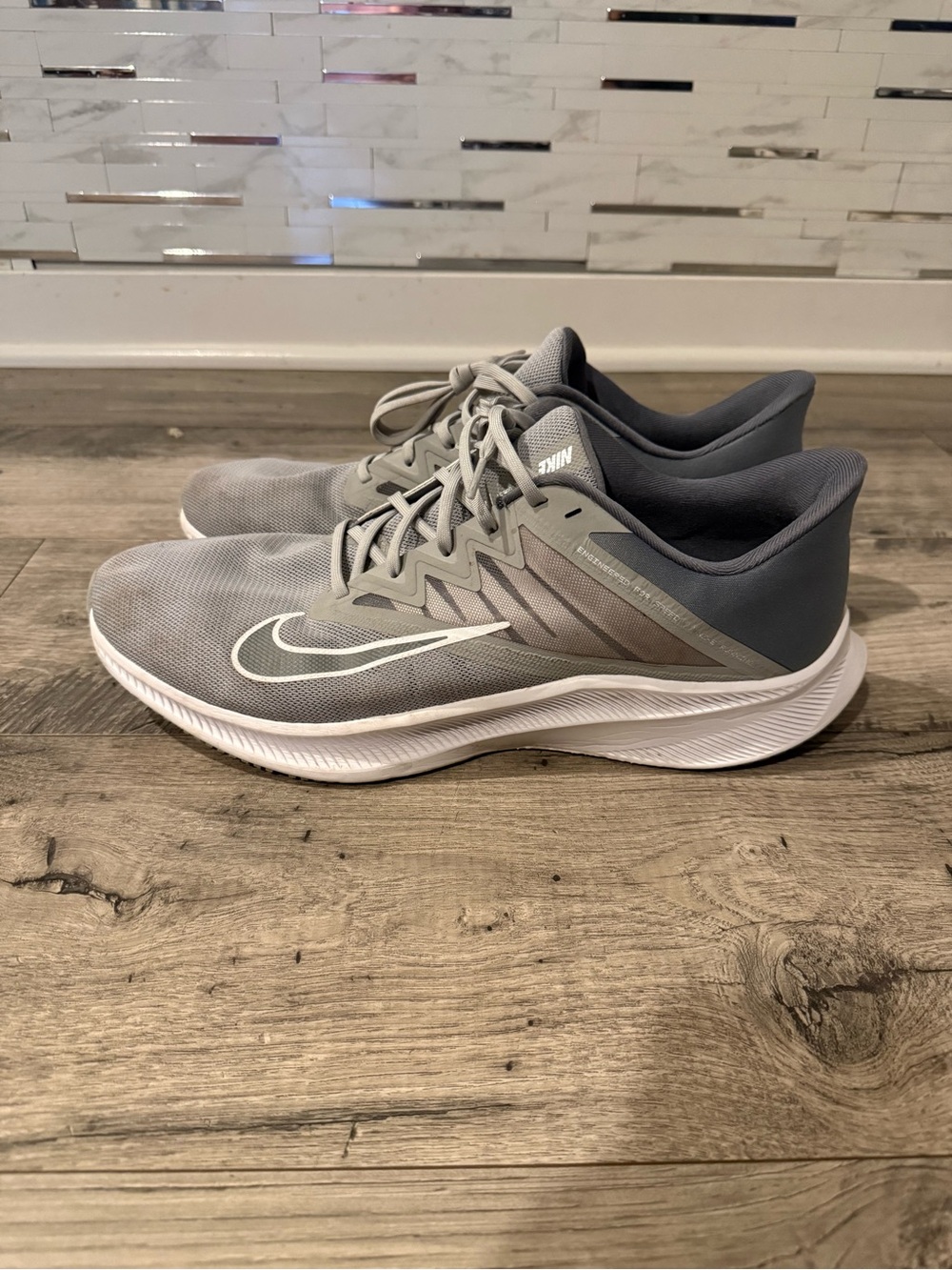 Nike Men's Gray Athletic Running Shoes with White Swoosh